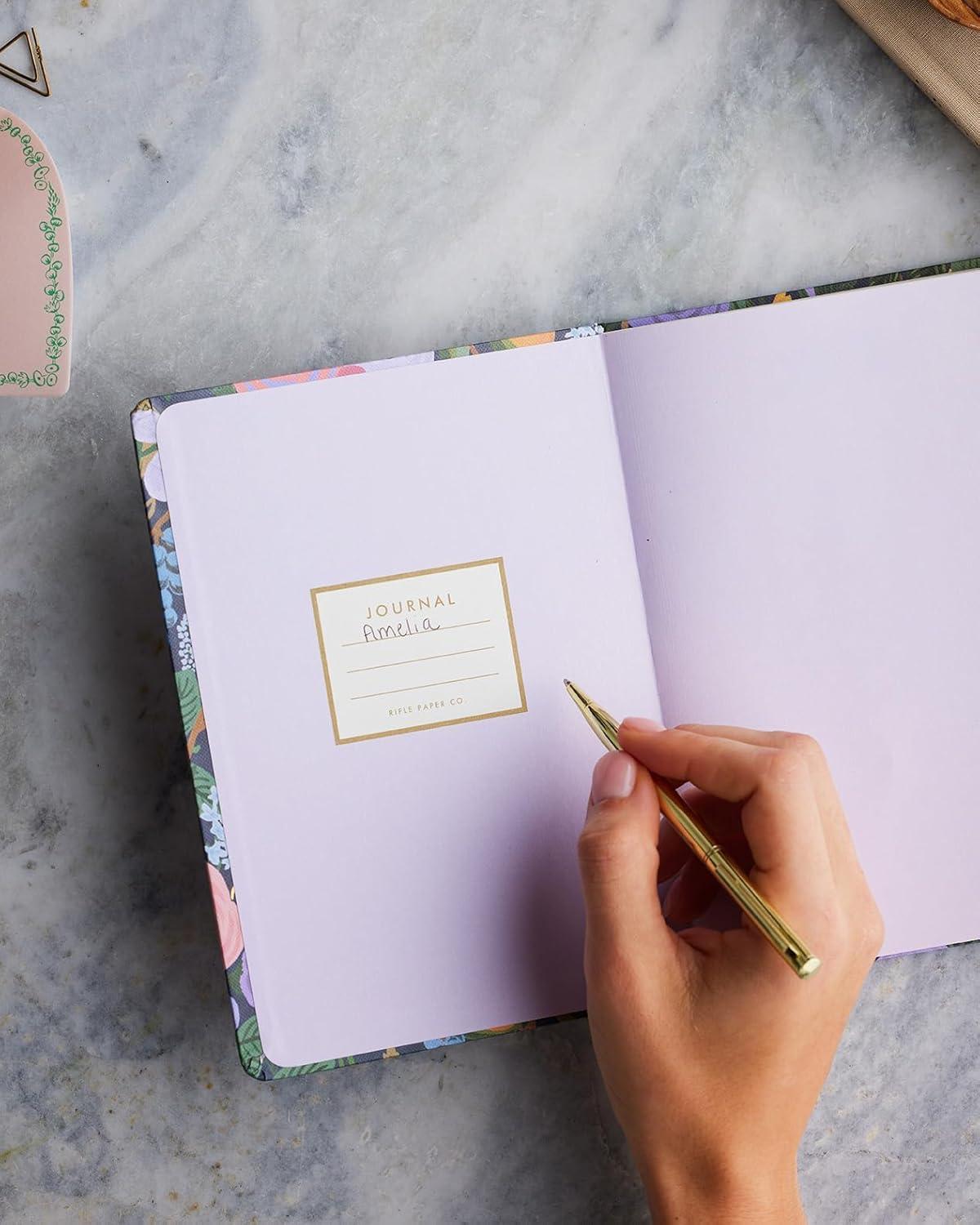 imageRIFLE PAPER CO Journal with Pen Hardcover Notebook with Foil Accents PaperWrapped Grayboard 144 Pages Elastic Band Closure Pocket for Extra Storage EsteeViolet Garden Party